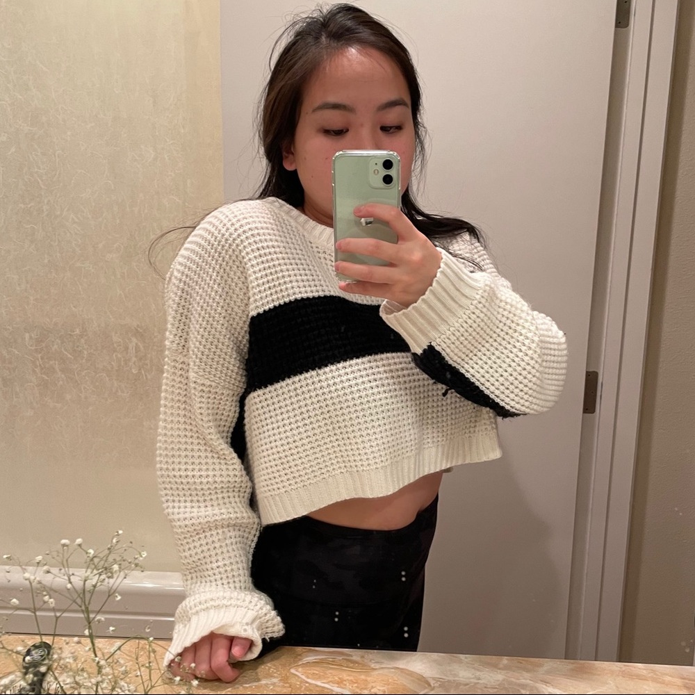 White and black sweater